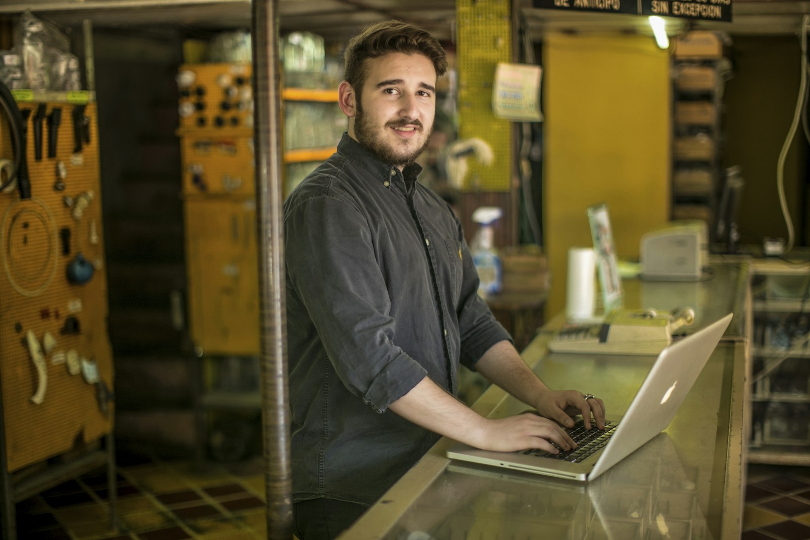 Small business owner working on their new website at a desk in a bright workspace