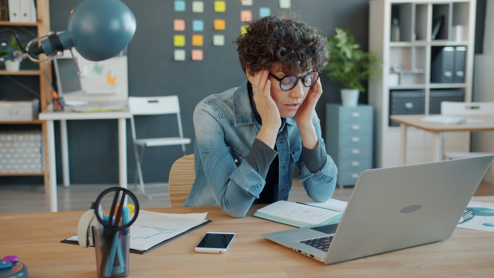 Small business owner looking frustrated at a laptop while searching for their website on Google